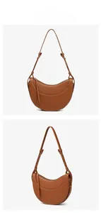 Macro detail of brown crescent shoulder bag featuring premium lychee grain leather texture