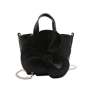 Elegant black petal flower handbag with beaded center and silver chain shoulder strap