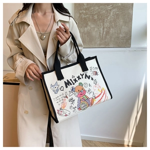Detail view of the canvas tote bag with street style teddy bear and fox graffiti print