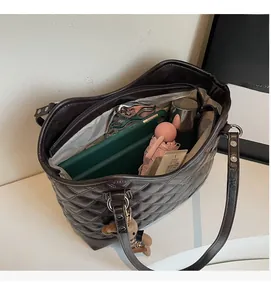 Top view showing the spacious interior compartment of a brown quilted tote bag