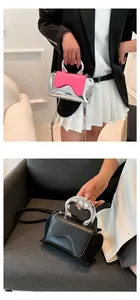 Detail of trendy mini bag featuring a unique liquid metal handle and wavy pink flap