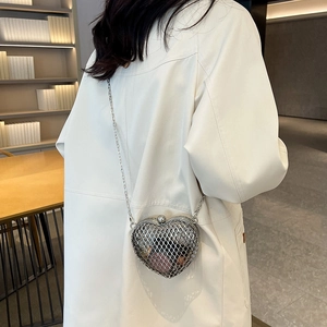 Minimalist silver heart-shaped metal mesh crossbody bag with thin chain strap