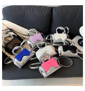 Mini metallic handbags in multiple colors featuring silver cutout handles and thin straps