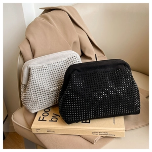 Detailed view of luxury trapezoid evening bags with shimmering rhinestones and metal clasp