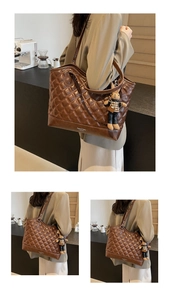 Detail of brown quilted tote bag with glossy finish and cute rabbit charm on side
