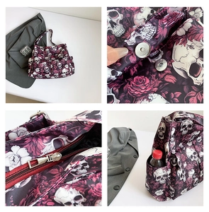 Detail of gothic floral skull canvas tote bag with multi-pocket storage and zip closure