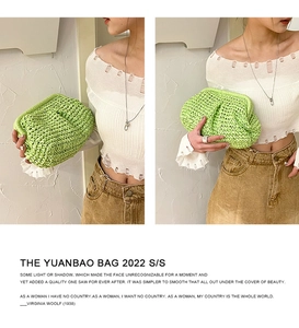 Detail of lime green hand-woven straw pouch bag featuring a pleated cloud structure