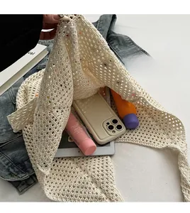 Detail of cream woven tote bag showing spacious interior and knit hollow texture