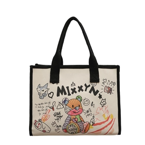 Minimalist canvas tote bag with street graffiti prints and black handles for daily use