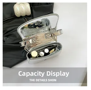 Interior view of silver patent leather shoulder bag showing large capacity for makeup