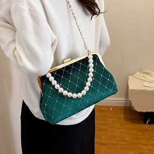 Elegant emerald green velvet shell bag with pearl handle and golden chain strap for women