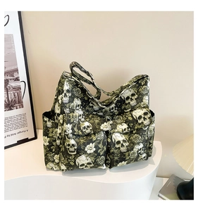 Macro shot of skull rose canvas crossbody bag with multiple pockets on a white podium