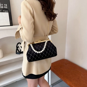 Elegant black velvet shell bag with pearl handle and golden chain for women