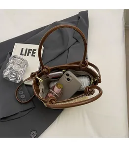 Top view of large straw bucket bag interior showing spacious storage for daily items
