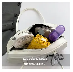 Capacity display of off-white PU leather tote bag with umbrella and daily essentials