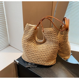 Detailed macro view of hollow crochet tote bag with premium brown leather handles and rivets