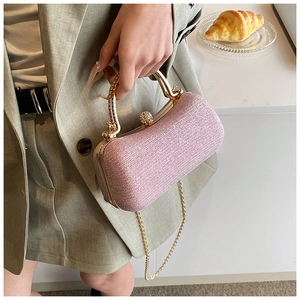 Pink glitter evening bag with gold rhinestone handle and chain strap for party use