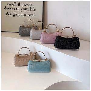 Multiple glitter evening clutch bags with round metal handles in various stylish colors