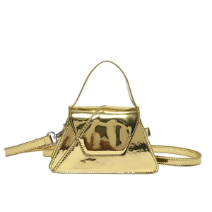 Modern geometric patent gold handbag with a trapezoid shape and adjustable shoulder strap