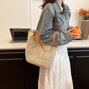 Beige hand-woven cotton tote bag with brown leather handles for casual daily style