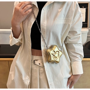 Golden star-shaped crossbody bag with heart-eye smiley face and metallic chain strap