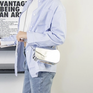 Sleek silver mirror chain bag with metallic finish and minimalist shoulder strap style