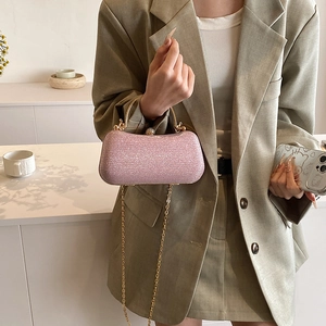Pink glitter evening clutch bag with gold handle and chain strap for parties