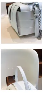 Detailansicht der geflochtenen Eimer-Tasche mit Fokus auf die weiße Lederstruktur