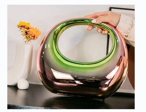 Macro view of gradient electroplated acrylic moon bag with iridescent rose gold finish