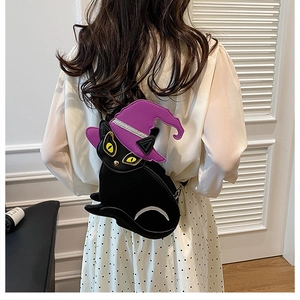 Detail of creative black cat Halloween backpack with purple wizard hat on model back