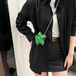 Metallic green star-shaped crossbody bag with smiley face and silver chain strap