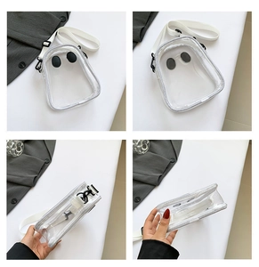 Macro view showing transparent PVC crossbody bag with cartoon eyes and adjustable strap