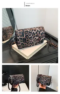 Detail of brown leopard print shoulder bag with adjustable strap and metallic finish