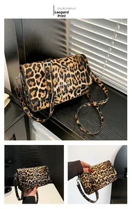 Detail of yellow leopard print crossbody bag with metal buckle and adjustable strap