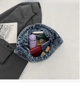 Interior view of the denim tote bag showing its large capacity for daily essentials