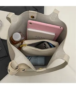 Spacious tote bag interior showing capacity for tablet, umbrella, and essentials