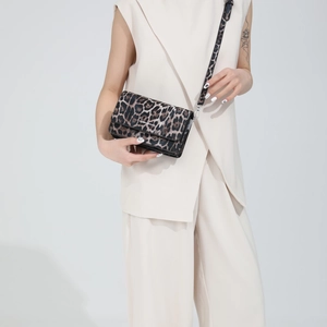 Fashionable leopard print crossbody flap bag with textured PU leather and shoulder strap