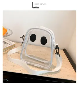Detail of cute ghost shaped transparent PVC crossbody bag with white fabric trim