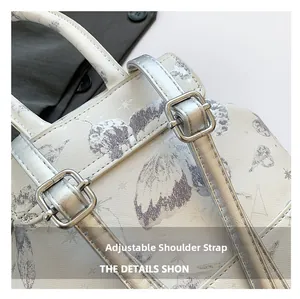 Detail of adjustable star print backpack strap with silver metal buckle and fine texture