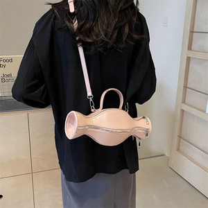 Sac à main en cuir en forme de bonbon rose-orange avec une bandoulière réglable