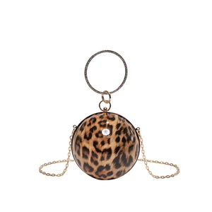 Spherical leopard print evening bag with rhinestone ring handle and gold chain strap