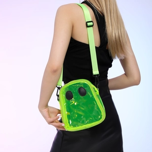 Fluorescent green ghost-shaped transparent PVC crossbody bag worn by a model