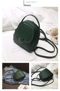 Detail showing the green mini backpack's lychee grain leather and metal ring buckle
