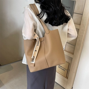 Fashionable brown large capacity tote bag with pleated design and printed ribbon detail