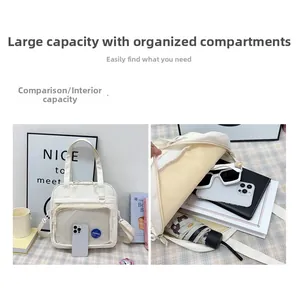 Internal view of a spacious white canvas tote bag with organized compartments and pockets