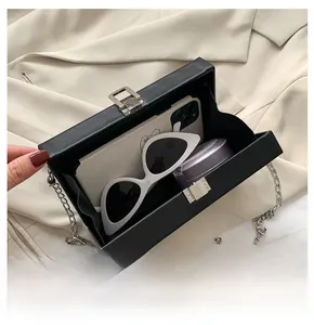 Internal view of radio-shaped box bag showing space for phone and sunglasses