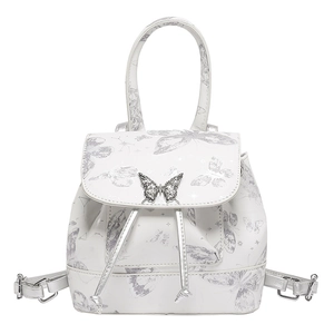 White leather backpack with silver butterfly prints and a metal butterfly buckle clasp