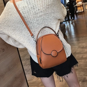 Mini orange-brown lychee textured backpack with adjustable straps for women