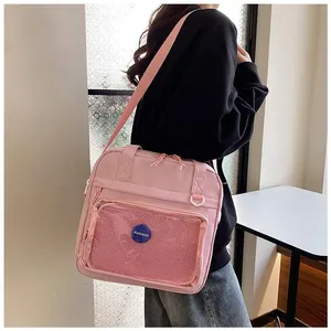 Pink multi-purpose shoulder bag with mesh zip pocket and Fashion patch detail