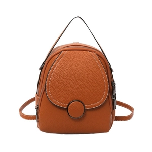Brown litchi grain mini backpack for women with white contrast stitching and round buckle